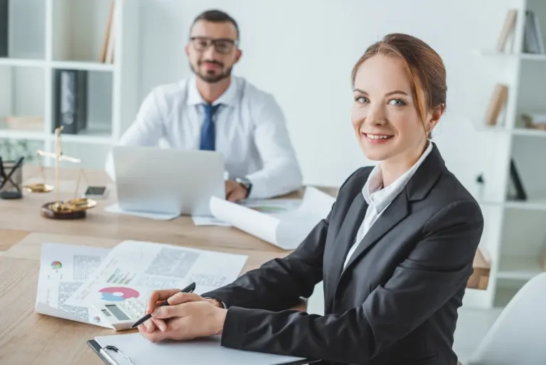 smiling financiers looking at camera in office 2023 11 27 05 34 53 utc